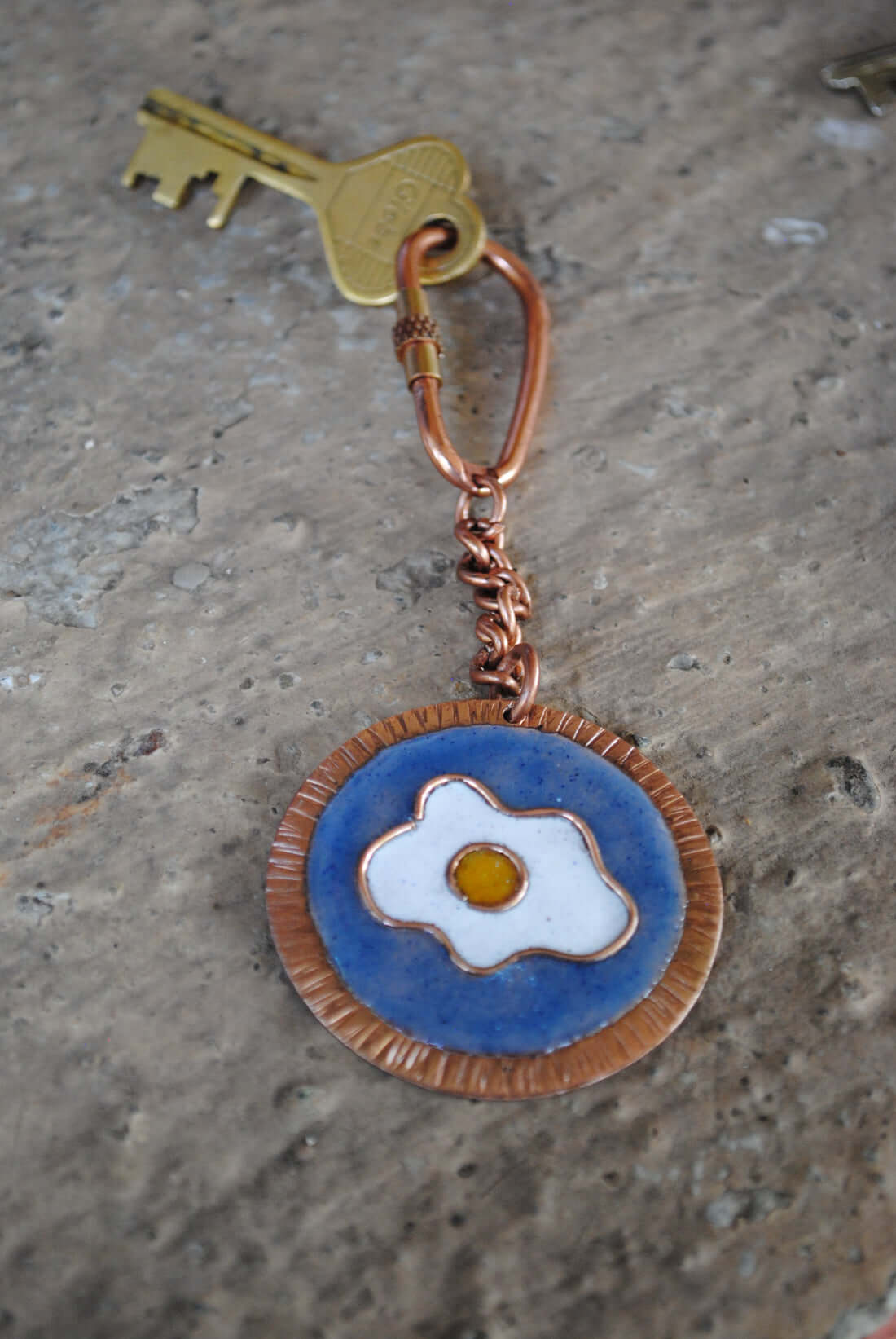 Copper enamel trinkets, keychain handcrafted in Maharashtra, India. Funky egg design