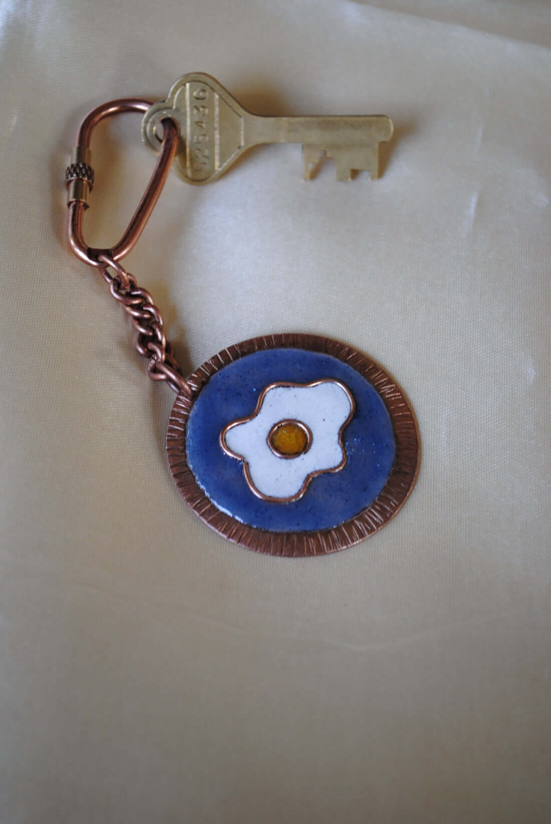 Copper enamel trinkets, keychain handcrafted in Maharashtra, India. Funky egg design