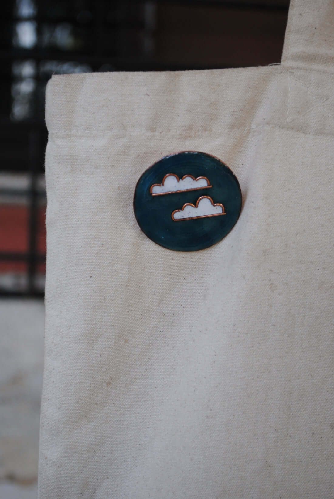 Copper enamel jewelry, lapel pin handcrafted in Maharashtra, India. Baadal design