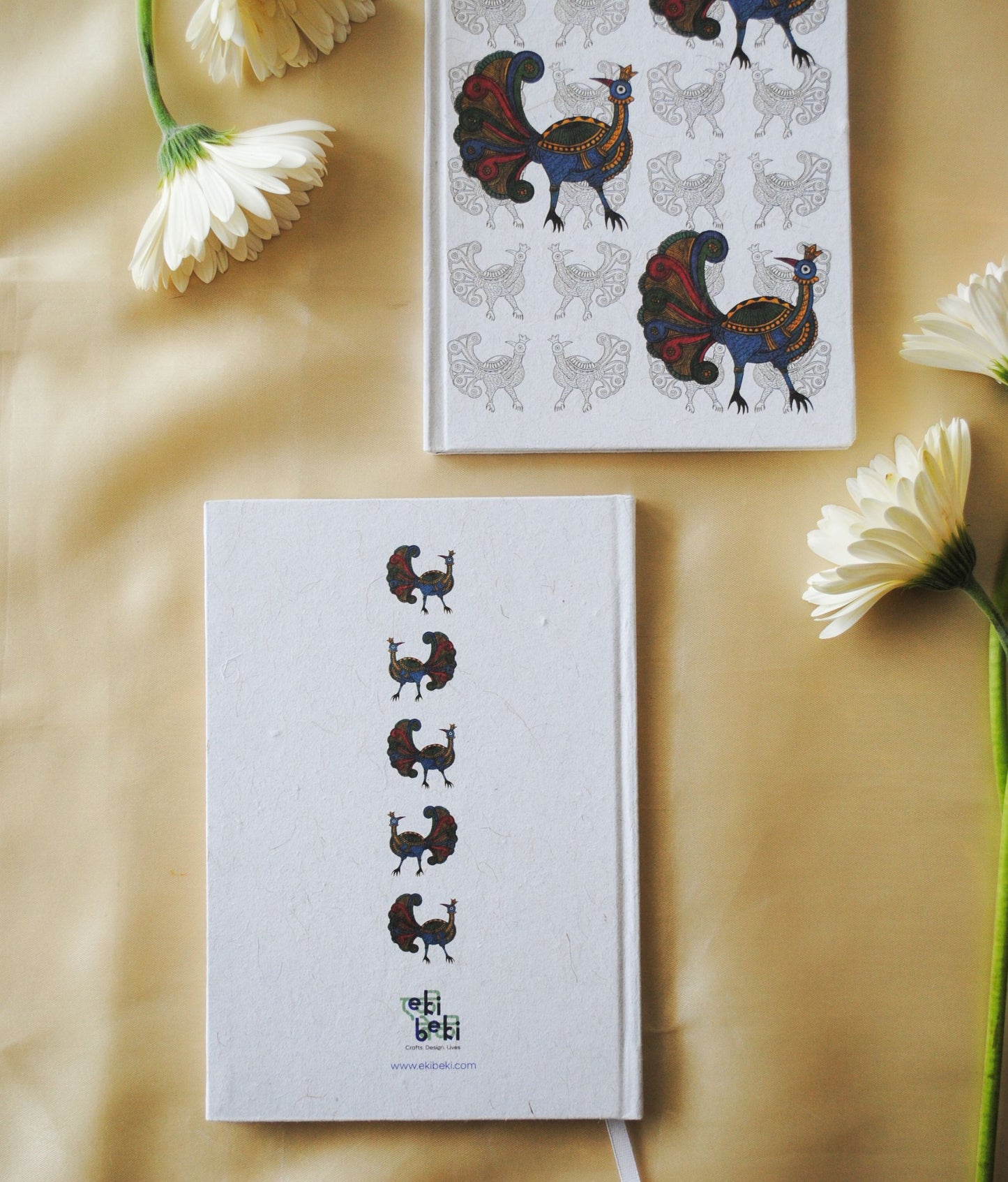 Artwork by native craftsmen of Chitrakathi, Gond, that are used as motifs to create stationery. This one is the peacock motif