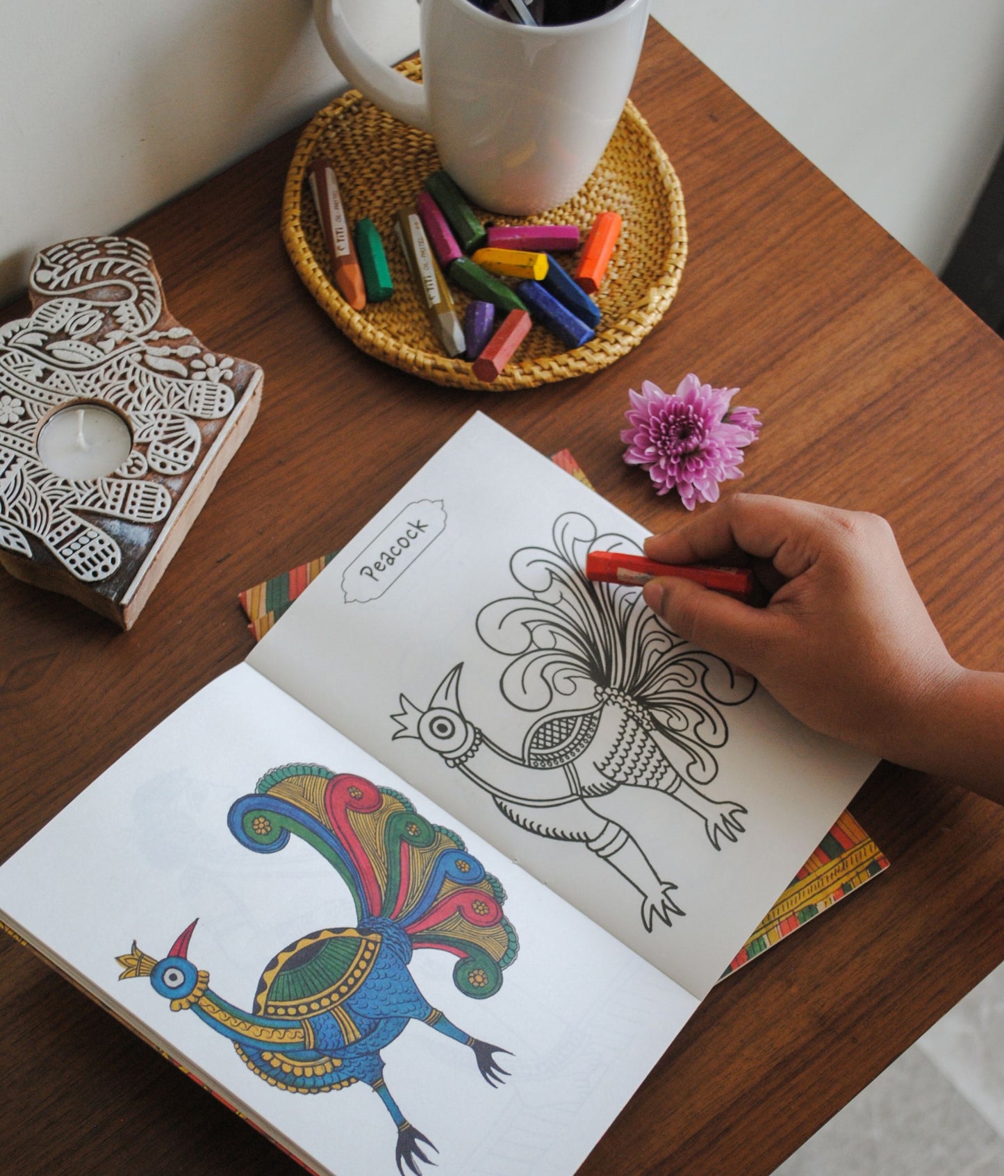 Artwork by native craftsmen of Chitrakathi, Gond, that are used as motifs to create stationery and colouring books