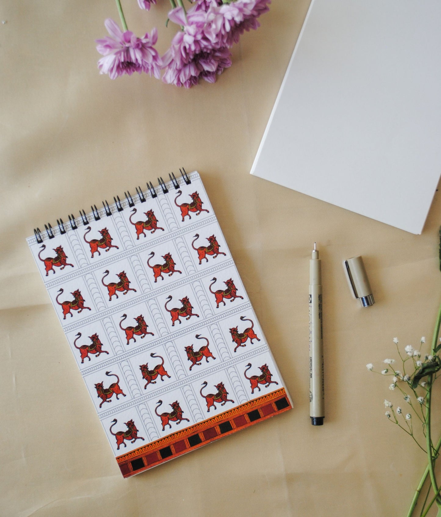 Artwork by native craftsmen of Chitrakathi, Gond, that are used as motifs to create stationery. This one is Vishnu avtaar as wild boar