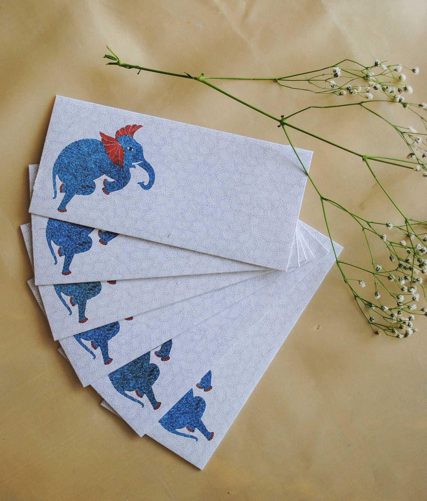 Artwork by native craftsmen of Chitrakathi, Gond, that are used as motifs to create stationery. This one is the gajoba elephant motif