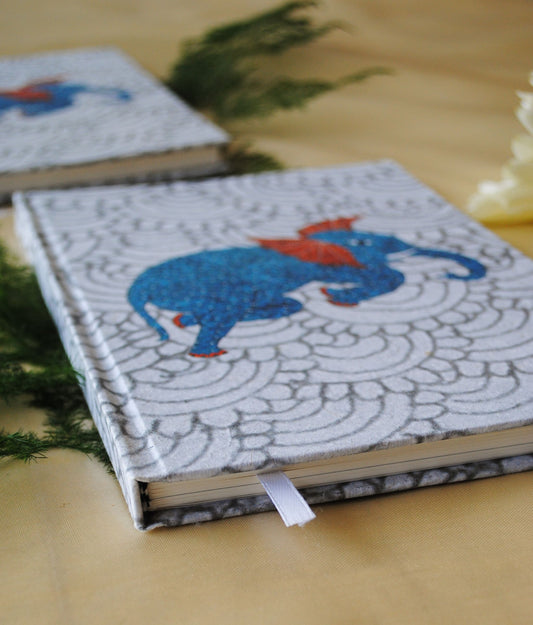 Artwork by native craftsmen of Chitrakathi, Gond, that are used as motifs to create stationery. This one is the gajoba elephant motif