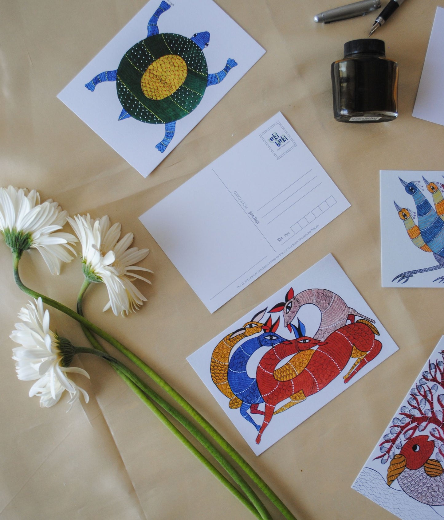 Artwork by native craftsmen of Chitrakathi, Gond, that are used as motifs to create stationery