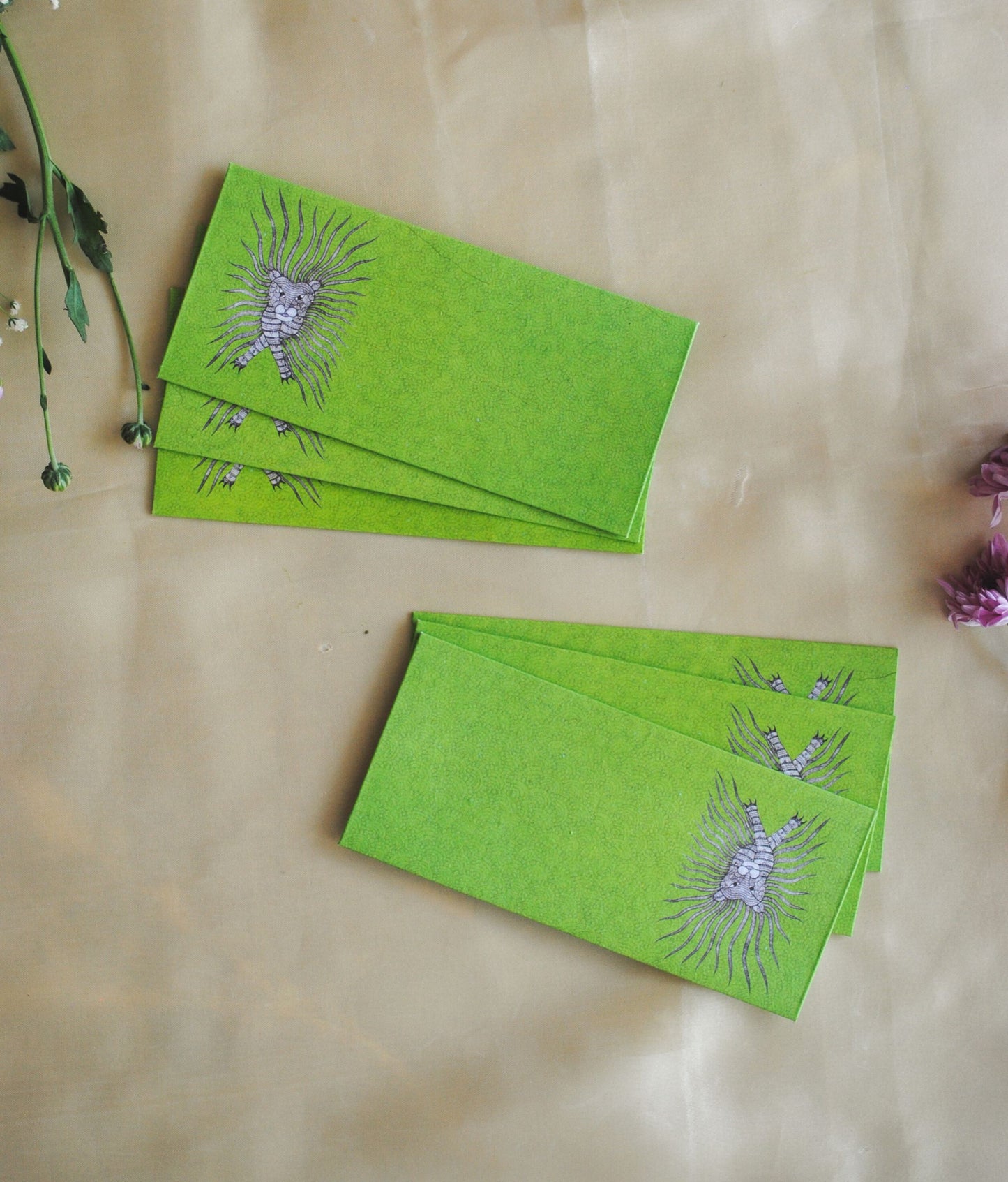 Artwork by native craftsmen of Chitrakathi, Gond, that are used as motifs to create stationery. This one is the waghoba lion motif