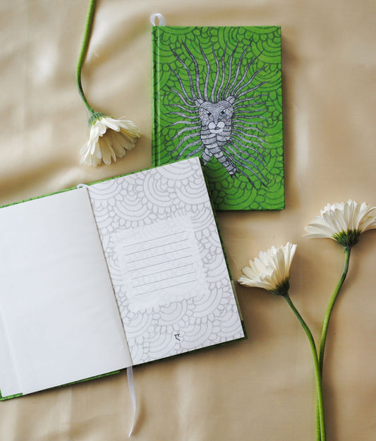 Artwork by native craftsmen of Chitrakathi, Gond, that are used as motifs to create stationery. This one is the waghoba lion motif