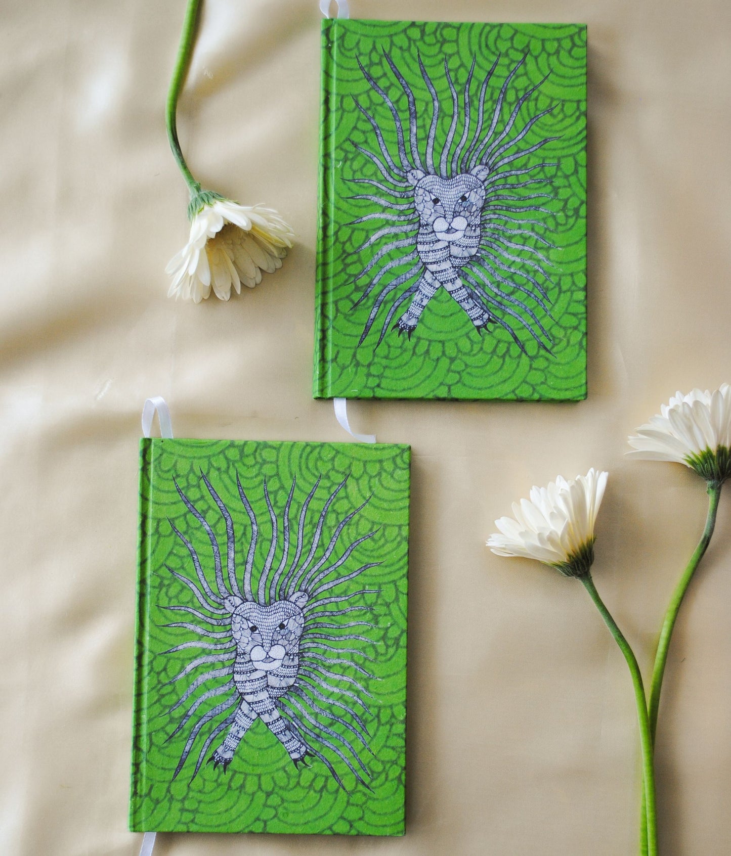 Artwork by native craftsmen of Chitrakathi, Gond, that are used as motifs to create stationery. This one is the waghoba lion motif