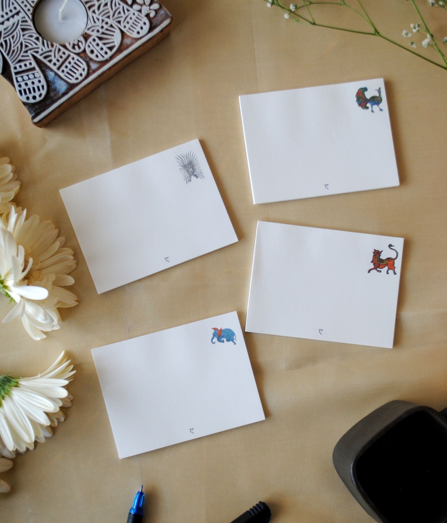 Artwork by native craftsmen of Chitrakathi, Gond, that are used as motifs to create stationery. This one is the waghoba lion motif