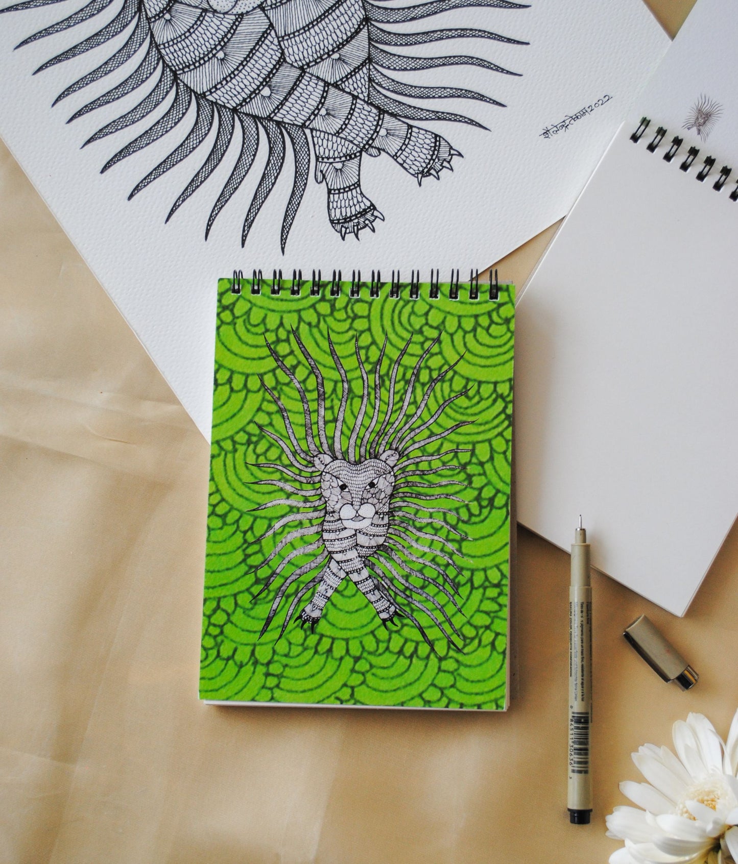 Artwork by native craftsmen of Chitrakathi, Gond, that are used as motifs to create stationery. This one is the waghoba lion motif