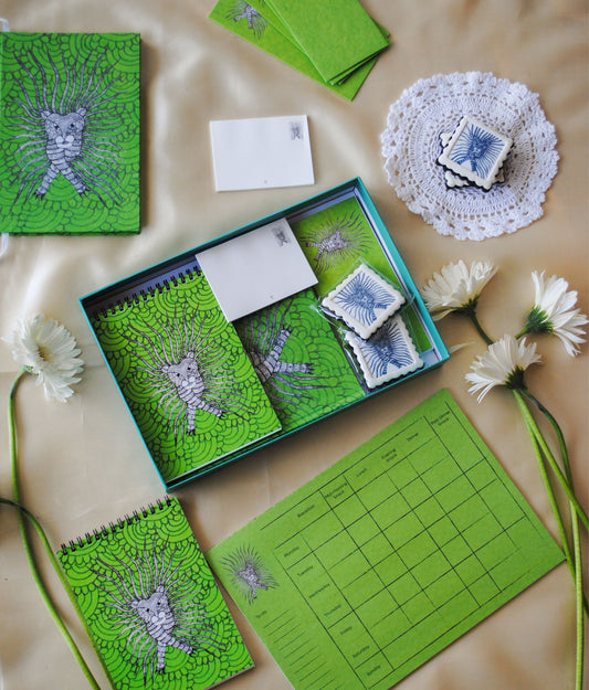 Artwork by native craftsmen of Chitrakathi, Gond, that are used as motifs to create stationery. This one is the waghoba lion motif