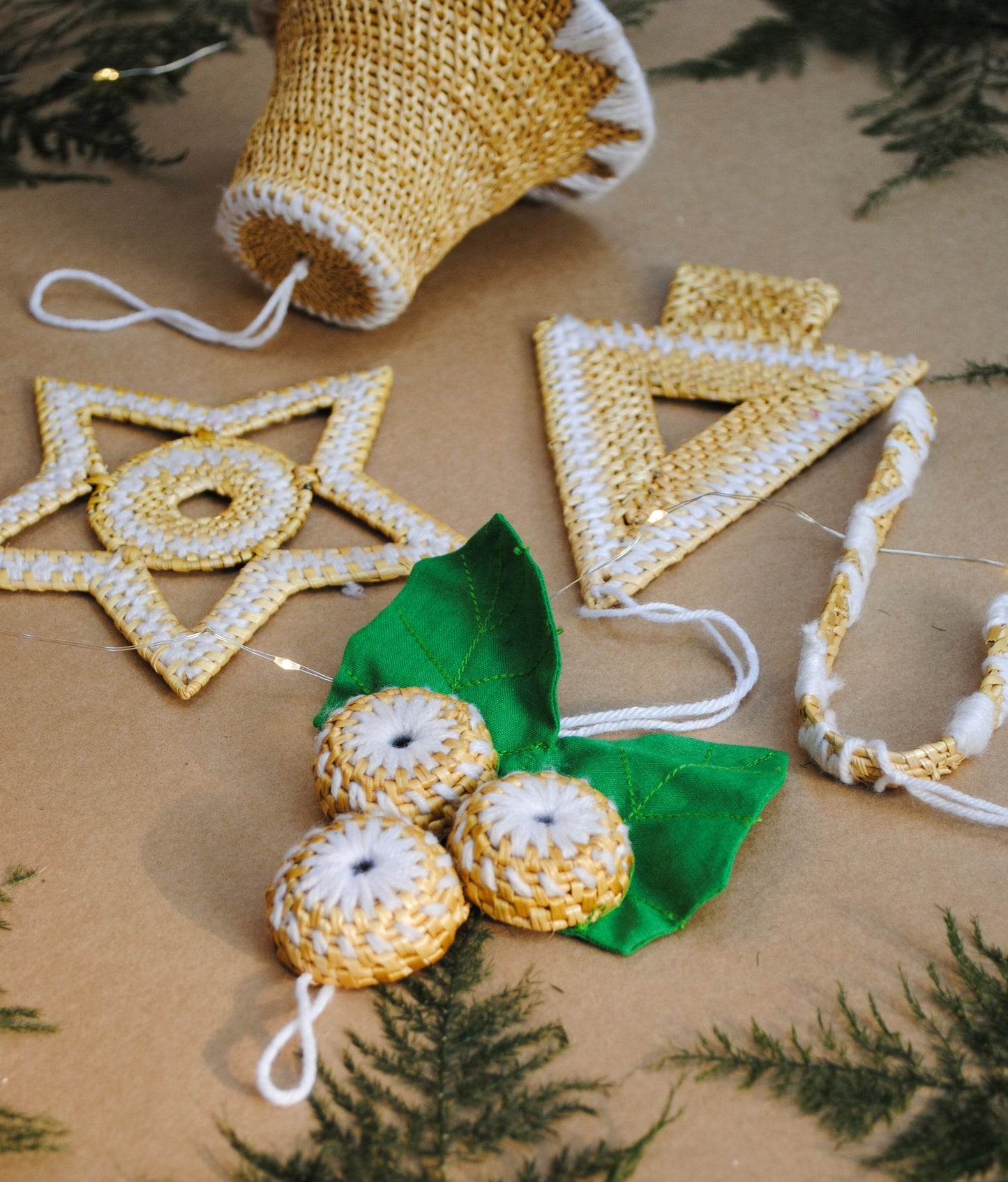 Handcrafted golden grass weavers create Christmas ornaments as new designs to keep the old art relevant in modern days