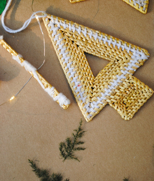 Handcrafted golden grass weavers create Christmas ornaments as new designs to keep the old art relevant in modern days