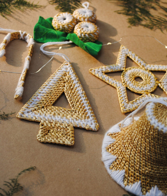 Handcrafted golden grass weavers create Christmas ornaments as new designs to keep the old art relevant in modern days