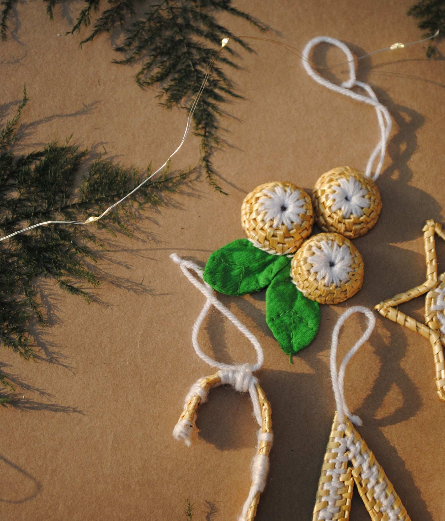 Handcrafted golden grass weavers create Christmas ornaments as new designs to keep the old art relevant in modern days