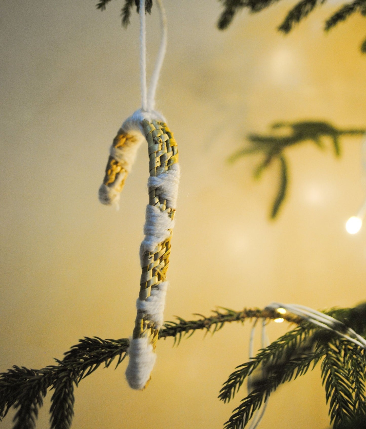 Handcrafted golden grass weavers create Christmas ornaments as new designs to keep the old art relevant in modern days