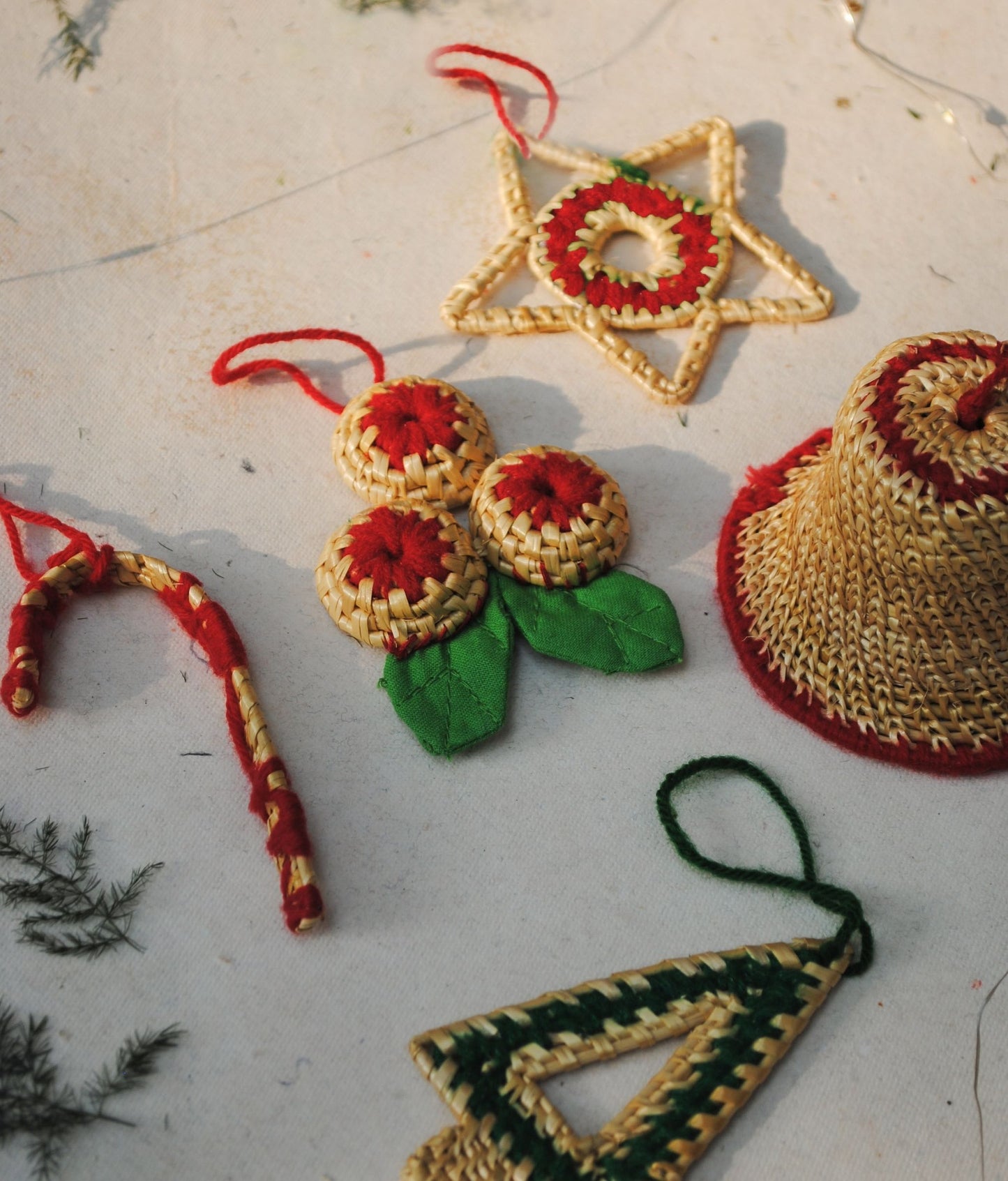 Handcrafted golden grass weavers create Christmas ornaments as new designs to keep the old art relevant in modern days