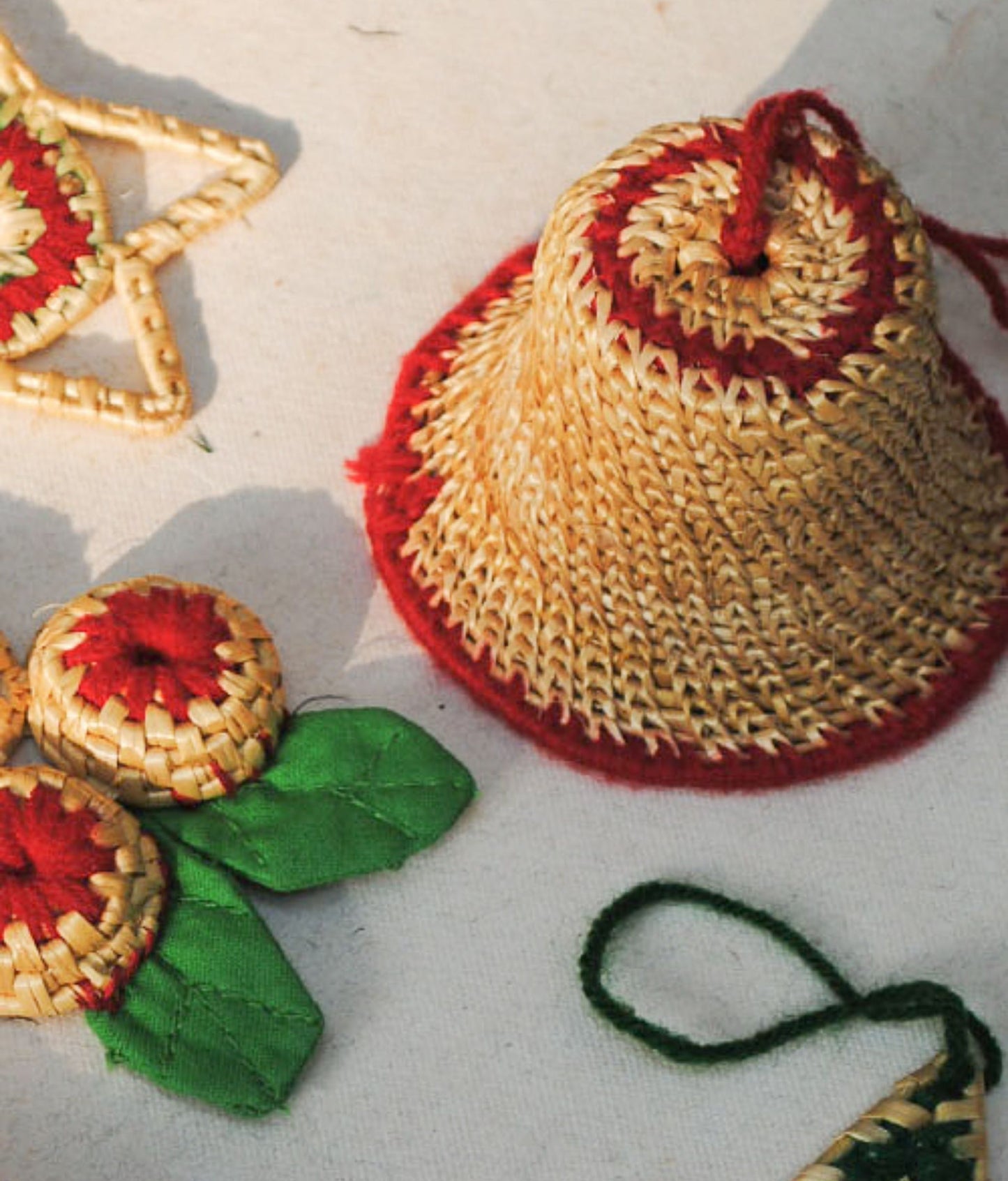 Handcrafted golden grass weavers create Christmas ornaments as new designs to keep the old art relevant in modern days