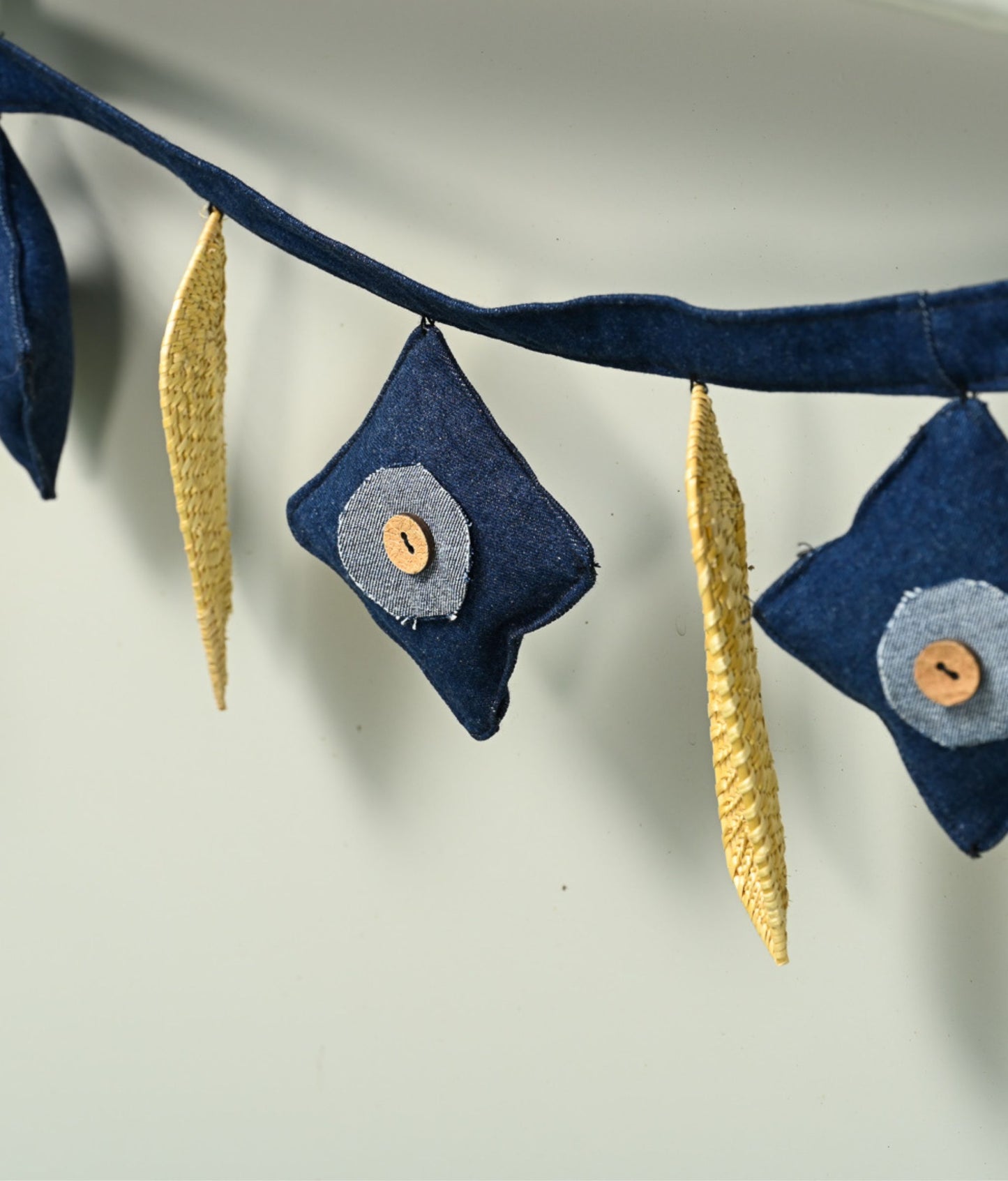 Handcrafted golden grass weavers create new designs to keep the old art relevant in modern days, as torans and wall hangings