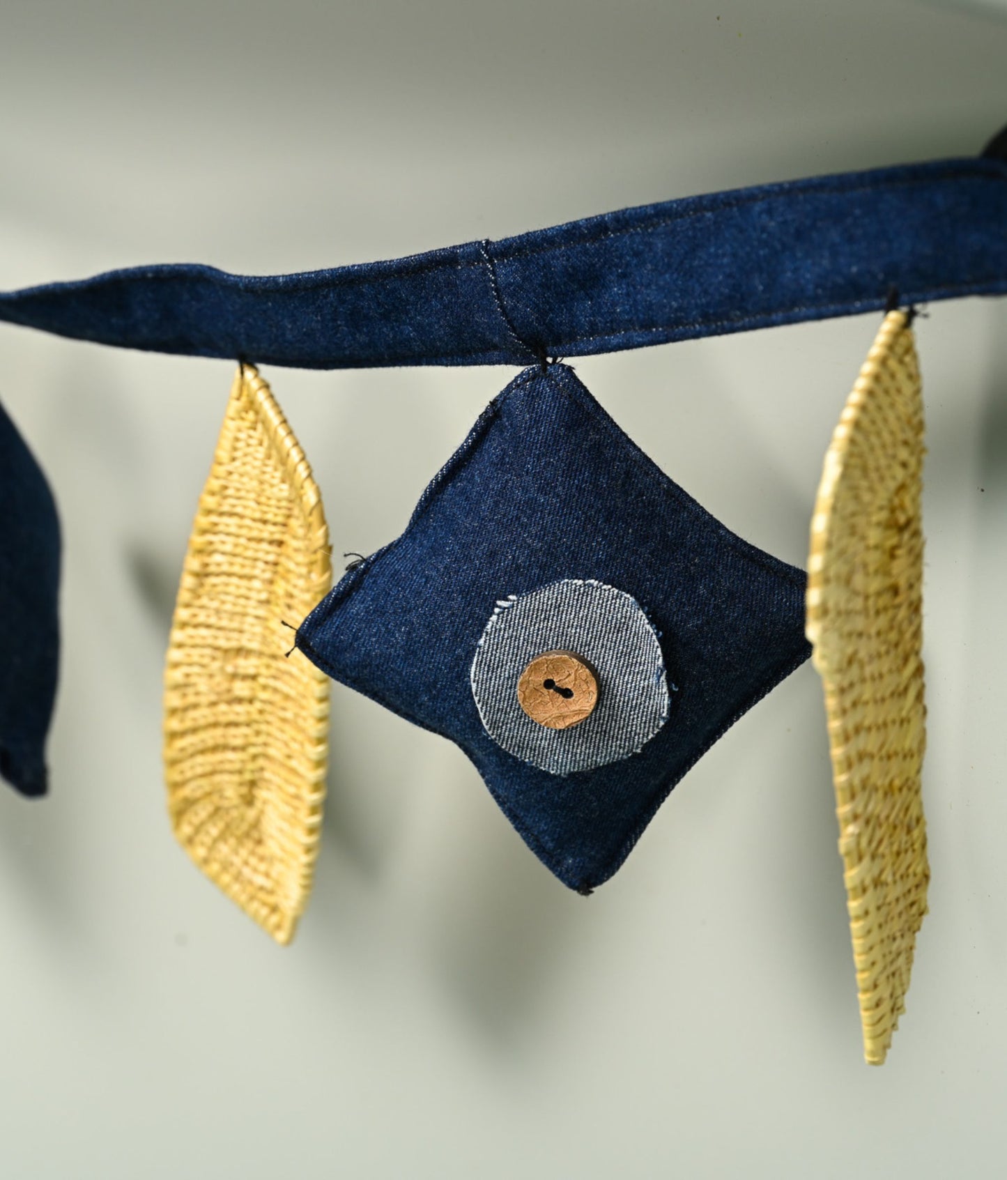 Handcrafted golden grass weavers create new designs to keep the old art relevant in modern days, as torans and wall hangings