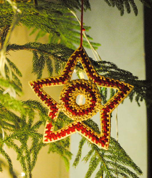 Handcrafted golden grass weavers create decorative items for Christmas, as new designs to keep the old art relevant in modern days