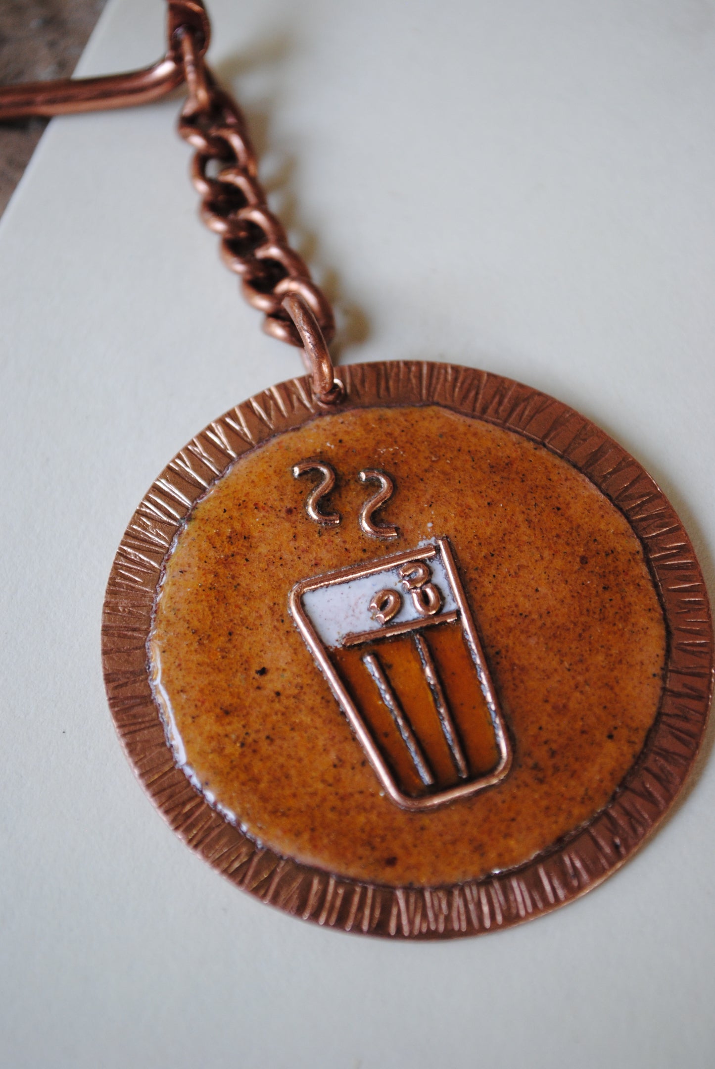 Copper enamel trinkets, funky keychains handcrafted in Maharashtra, India. Chai paani theme