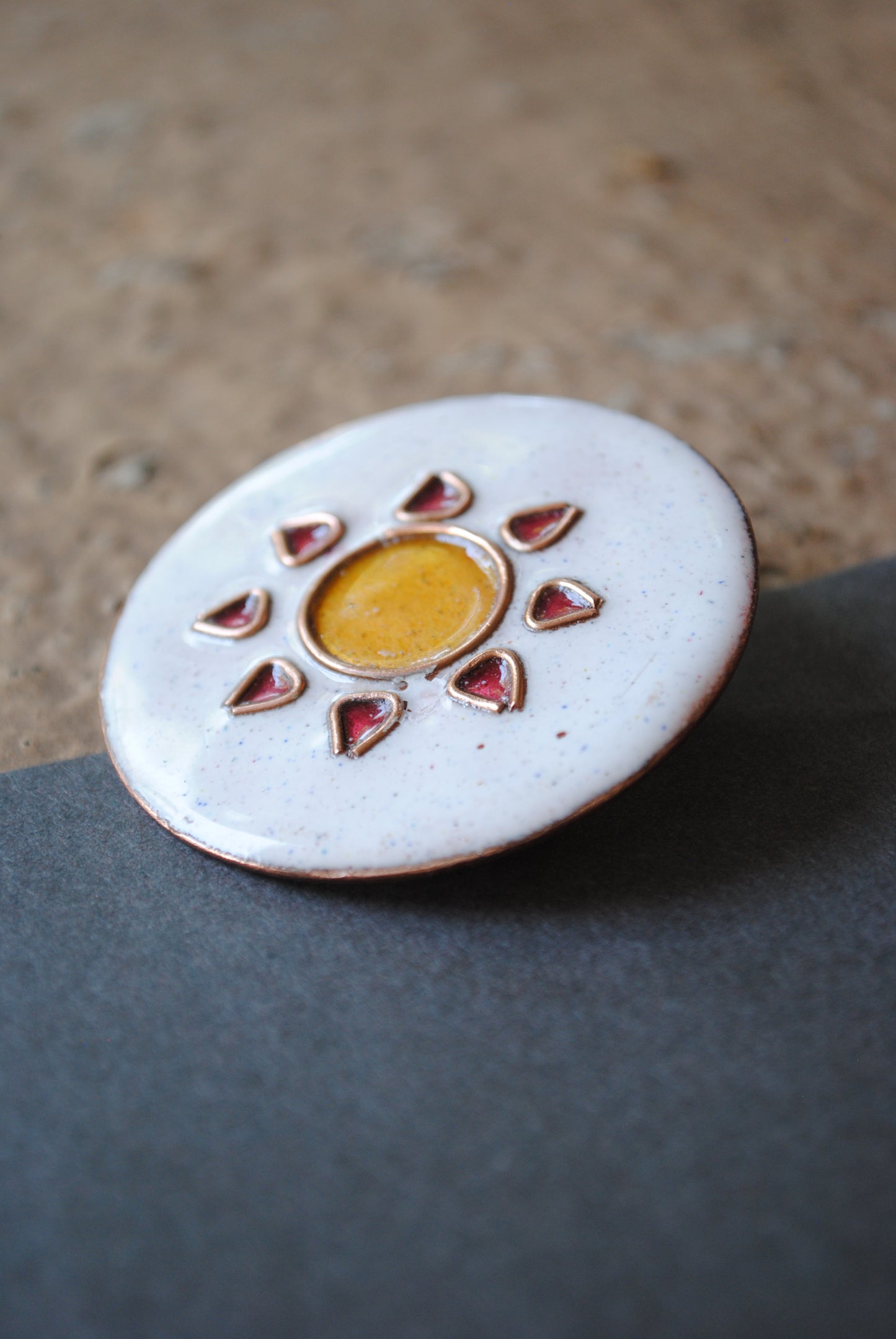 Copper enamel trinkets, funky lapel pins handcrafted in Maharashtra, India. Sun sooraj theme