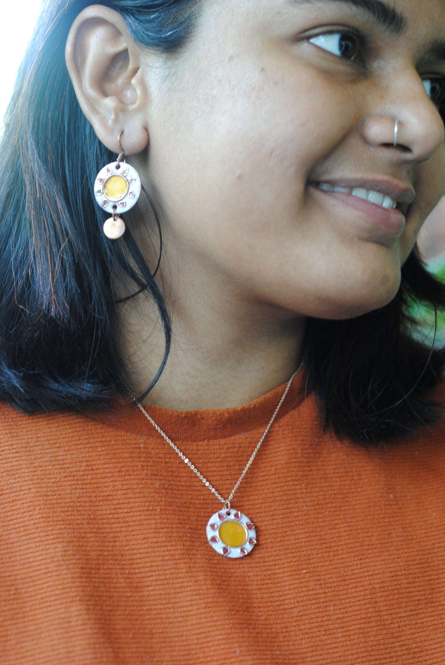 Copper enamel jewelry, funky pendant handcrafted in Maharashtra, India. Sun sooraj theme