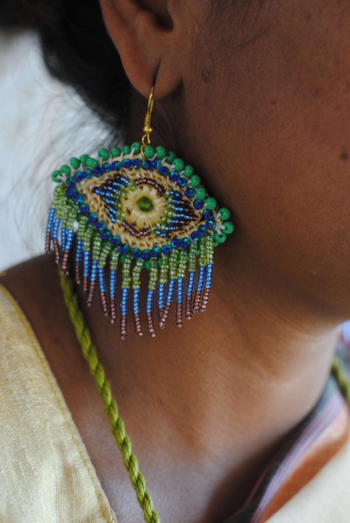 Truna natural fibre golden grass and zardosi handcrafted jewelry from Odisha, nazar peacock blue earrings set