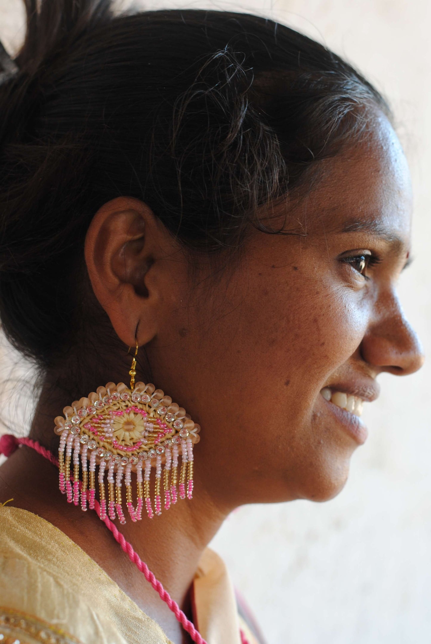 Truna natural fibre golden grass and zardosi handcrafted jewelry from Odisha, nazar pink earrings
