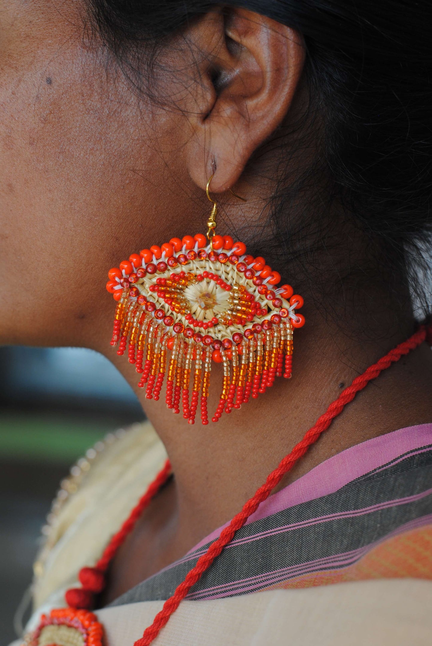 Truna natural fibre golden grass and zardosi handcrafted jewelry from Odisha, nazar red earrings