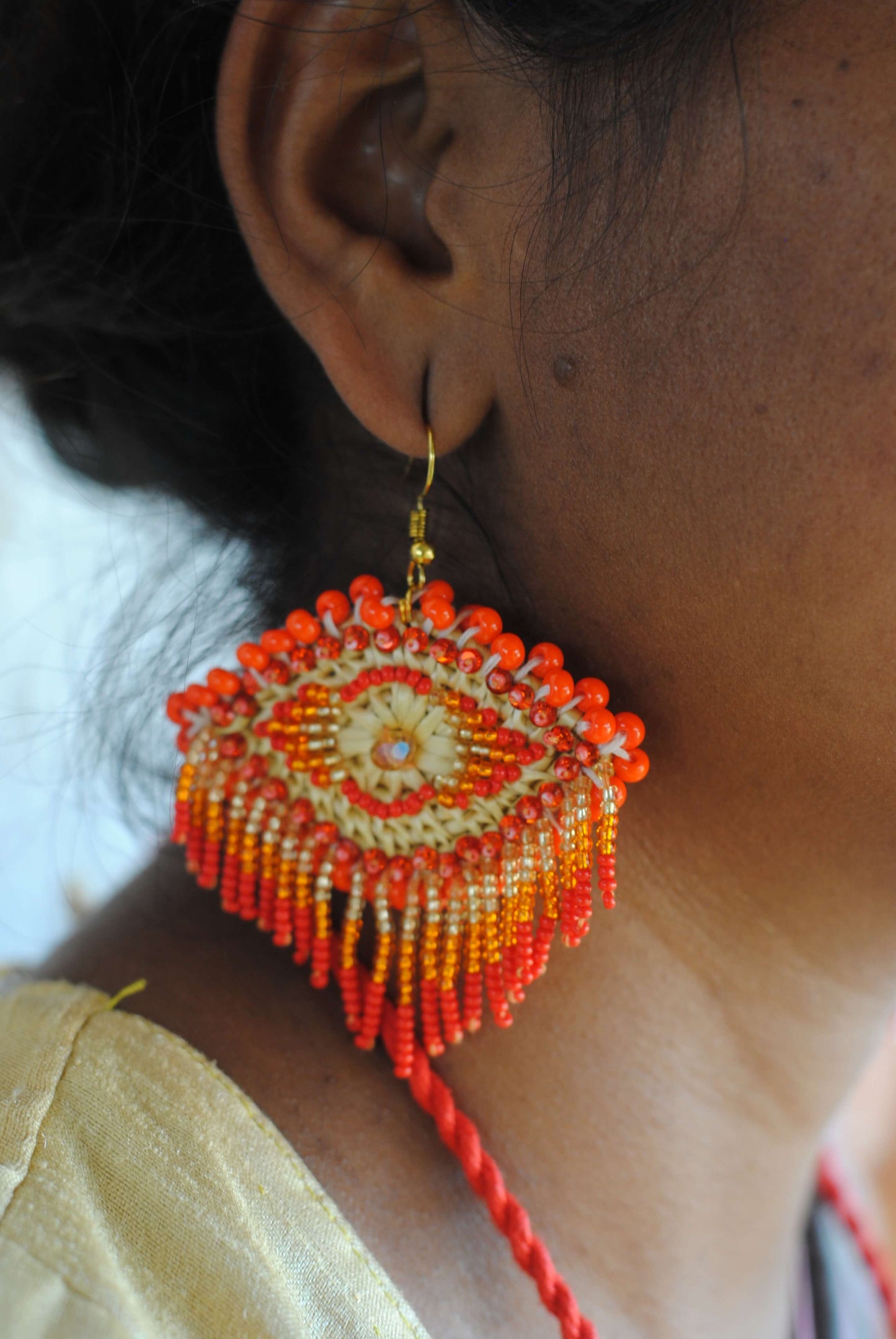 Truna natural fibre golden grass and zardosi handcrafted jewelry from Odisha, nazar red earrings