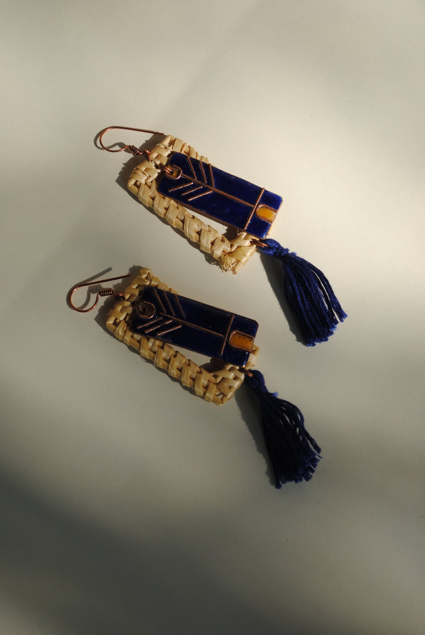 Truna natural fibre golden grass and copper enamel handcrafted jewelry from Odisha. Jharokha earrings in blue