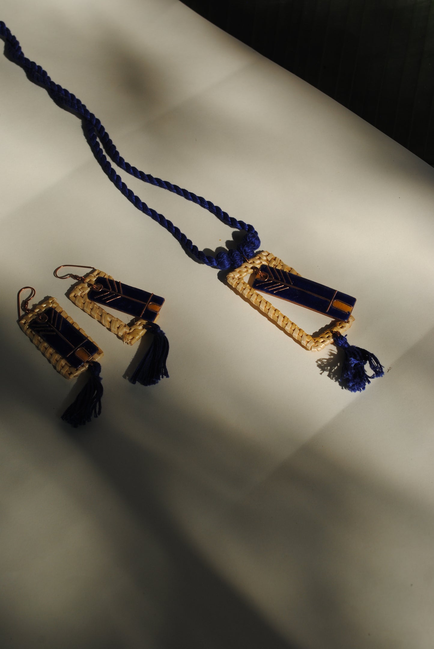 Truna natural fibre golden grass and copper enamel handcrafted jewelry from Odisha. Jharokha pendant and earring set