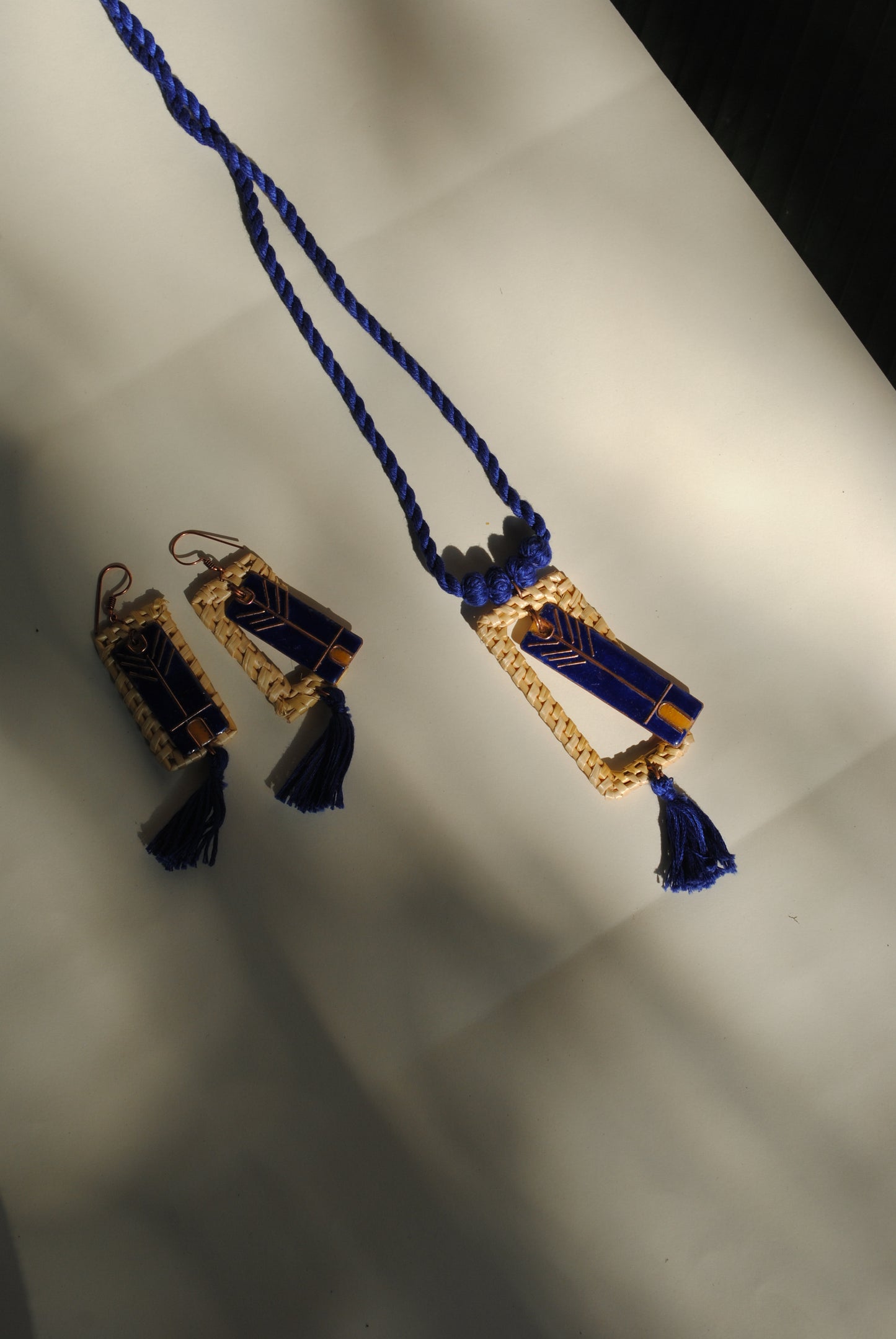 Truna natural fibre golden grass and copper enamel handcrafted jewelry from Odisha. Jharokha pendant and earring set