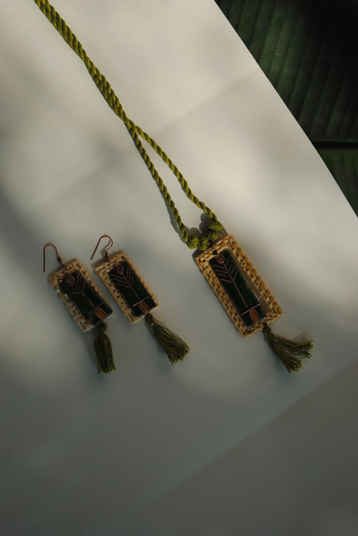 Truna natural fibre golden grass and copper enamel handcrafted jewelry from Odisha. Jharokha set of earrings and pendant
