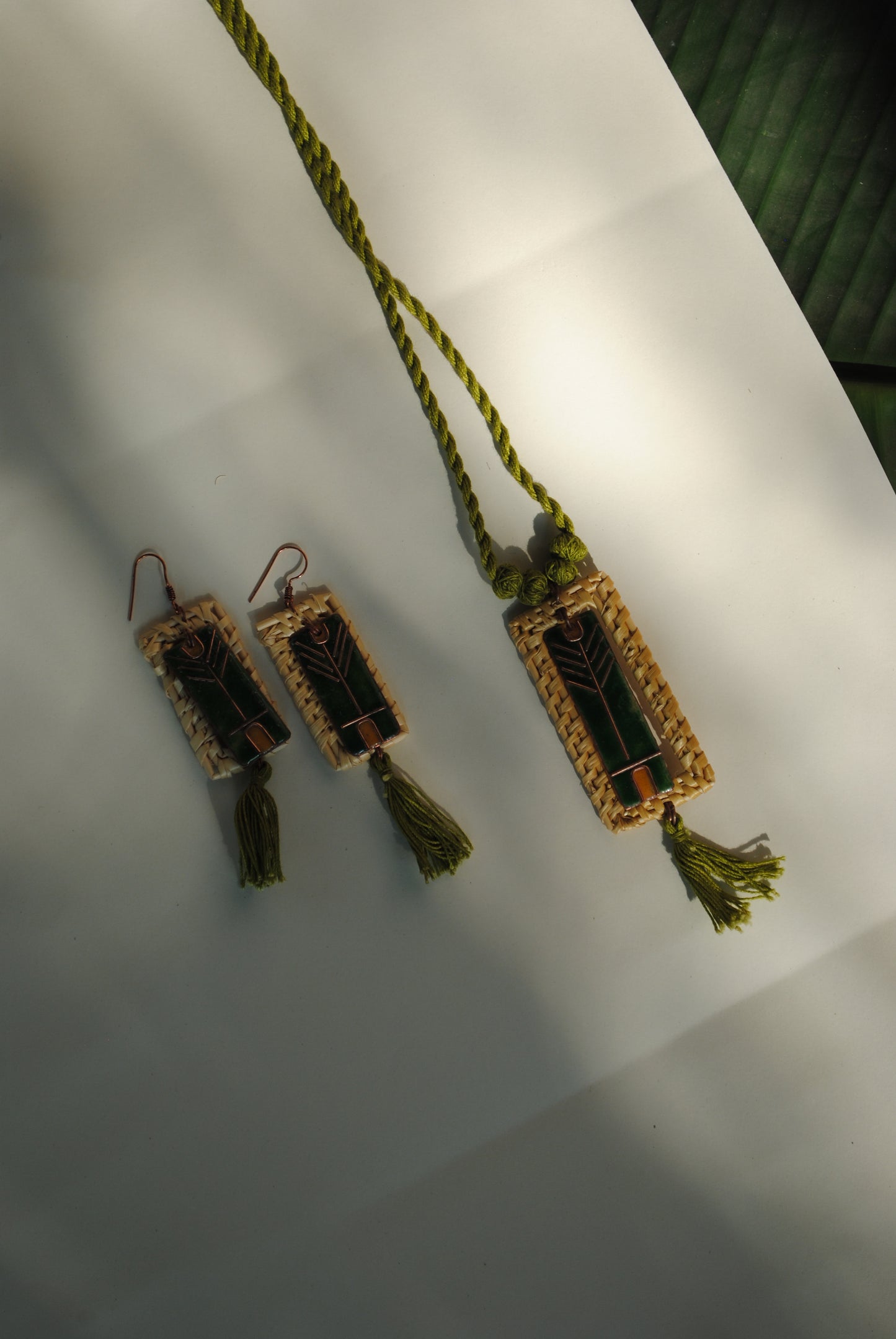Truna natural fibre golden grass and copper enamel handcrafted jewelry from Odisha. Jharokha set of earrings and pendant