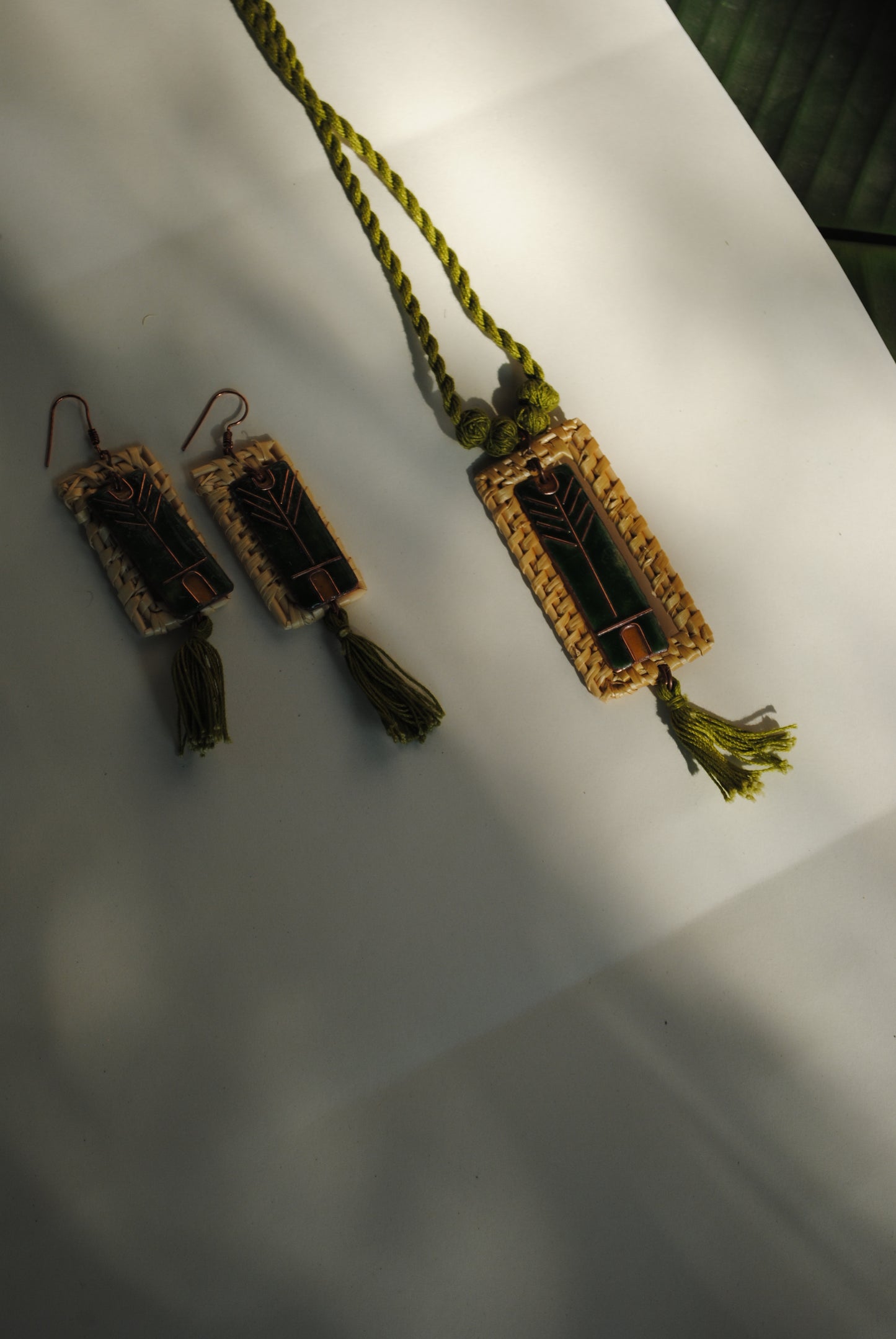 Truna natural fibre golden grass and copper enamel handcrafted jewelry from Odisha. Jharokha set of earrings and pendant