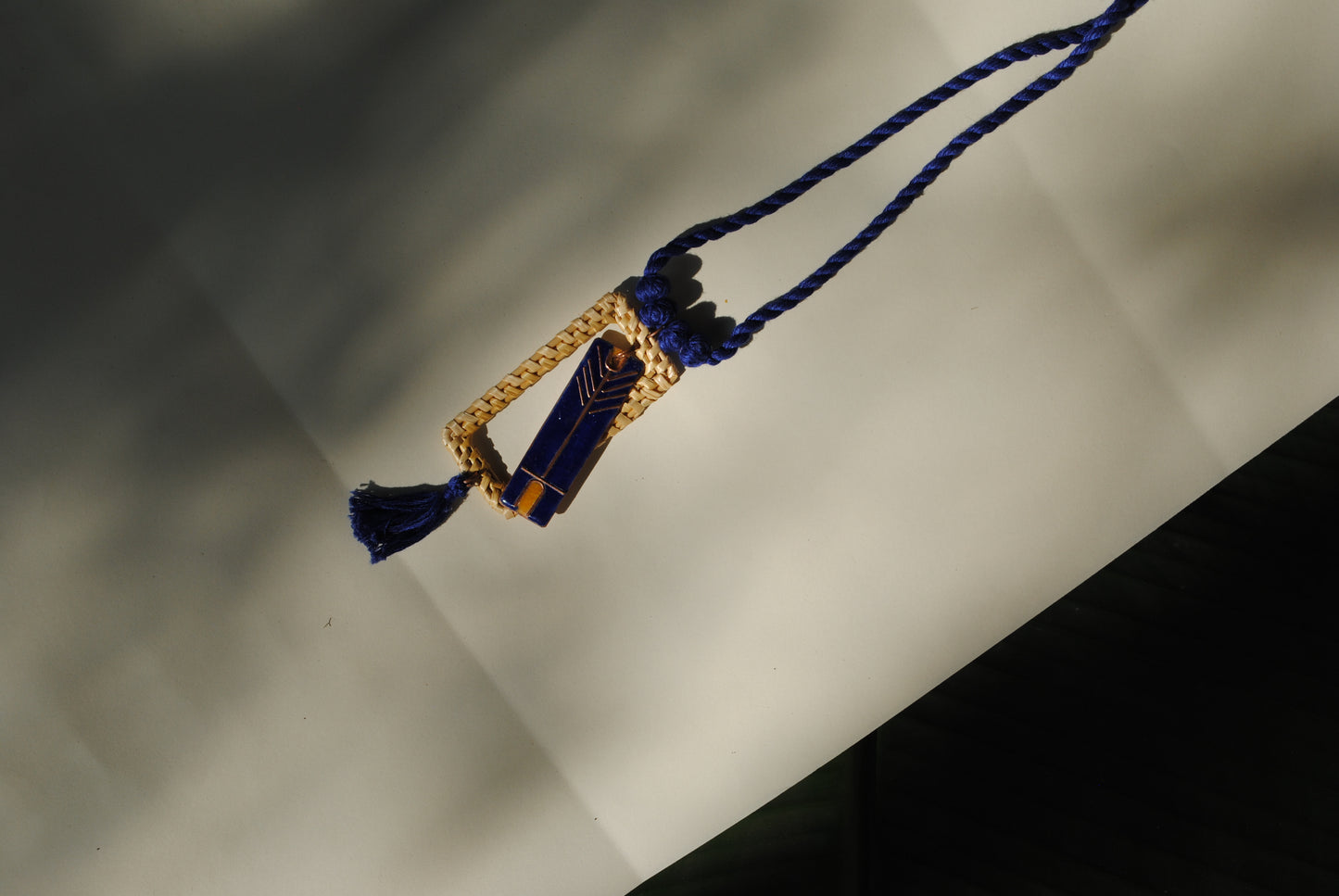 Truna natural fibre golden grass and copper enamel handcrafted jewelry from Odisha. Jharokha pendant in blue