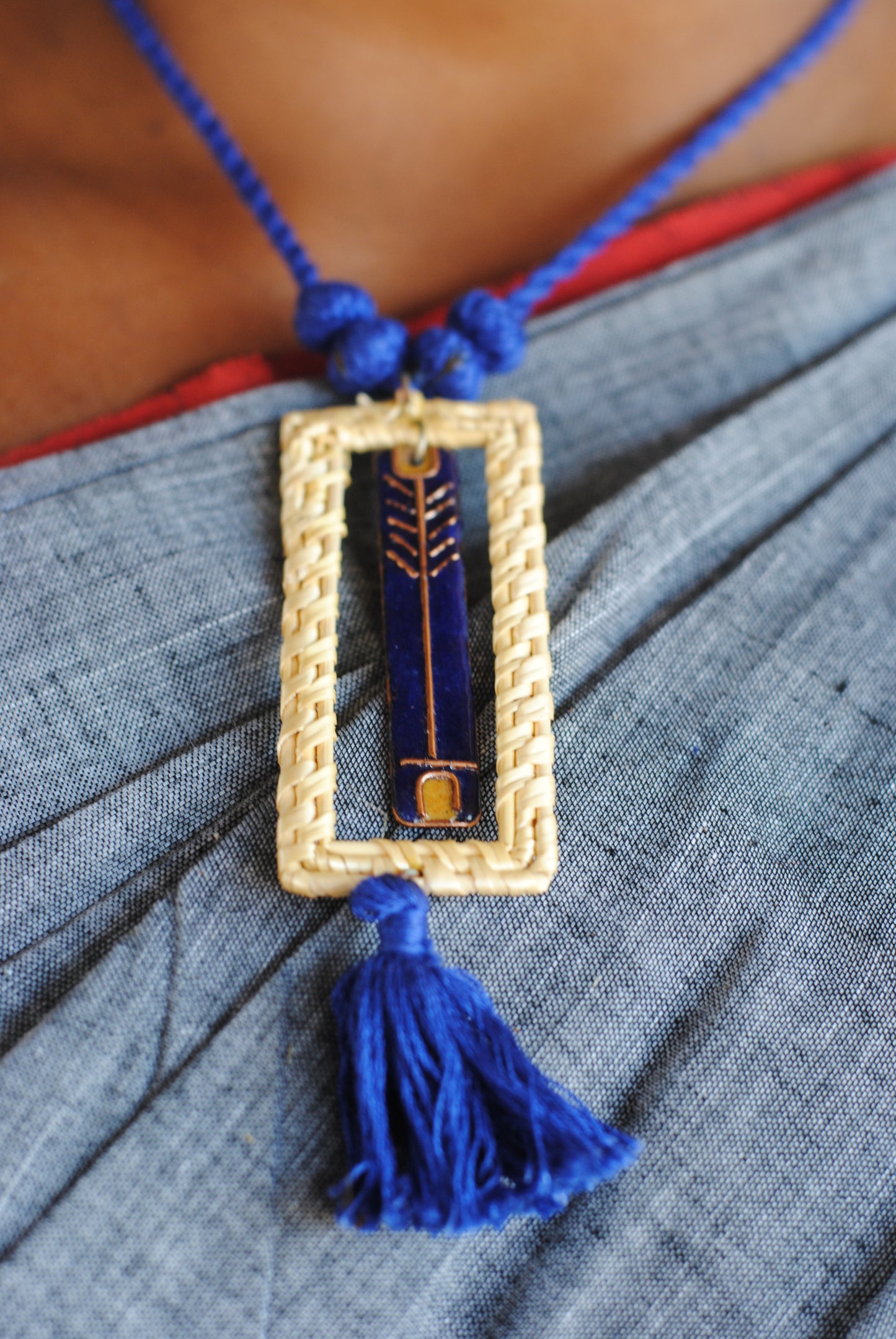 Truna natural fibre golden grass and copper enamel handcrafted jewelry from Odisha. Jharokha pendant in blue