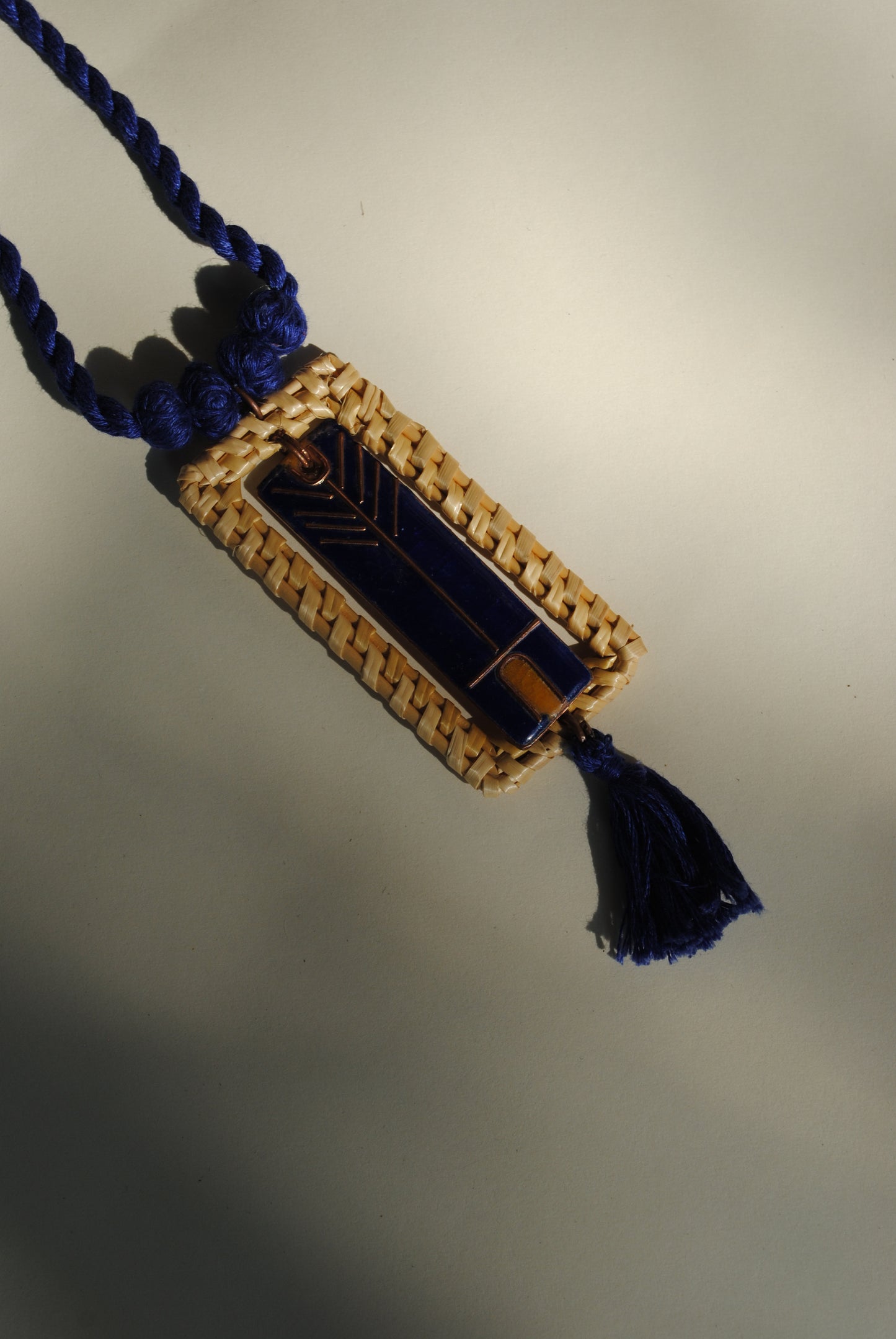 Truna natural fibre golden grass and copper enamel handcrafted jewelry from Odisha. Jharokha pendant in blue