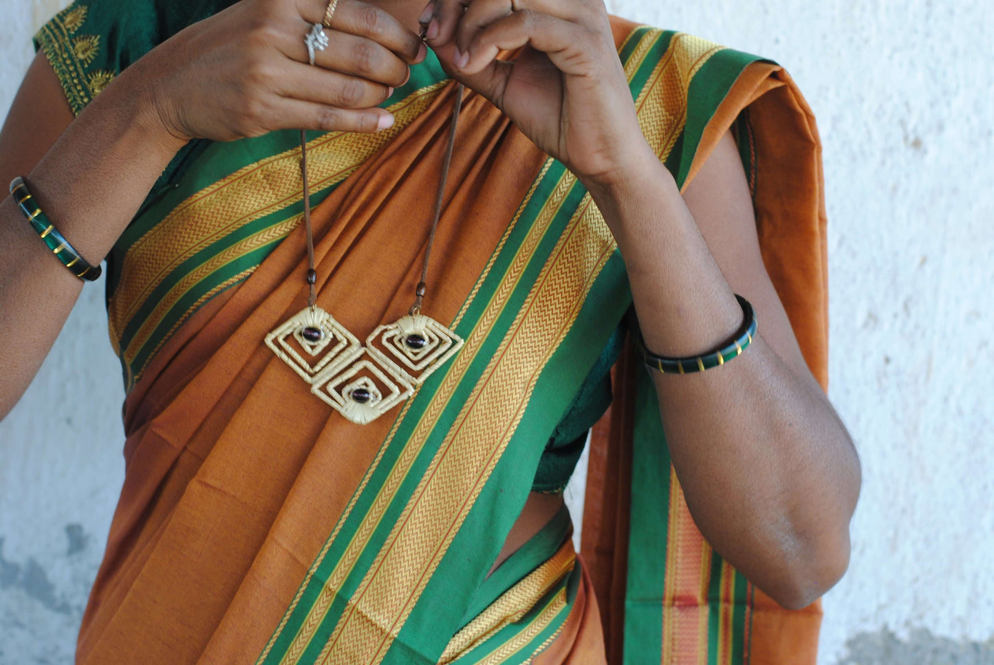 Truna natural fibre golden grass and copper enamel handcrafted earrings from Odisha, diamond shape
