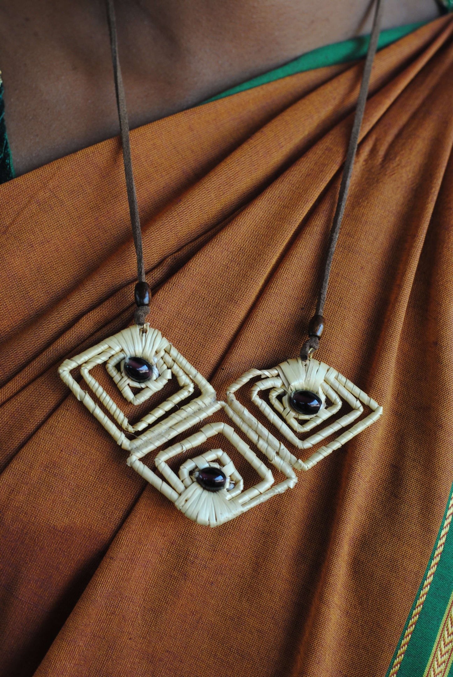 Truna natural fibre golden grass and copper enamel handcrafted earrings from Odisha, diamond shape