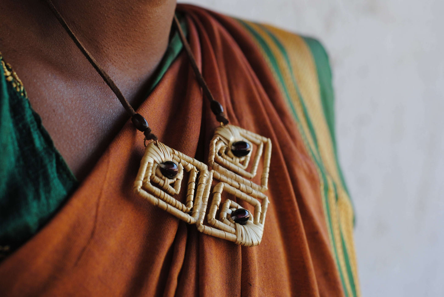 Truna natural fibre golden grass and copper enamel handcrafted earrings from Odisha, diamond shape