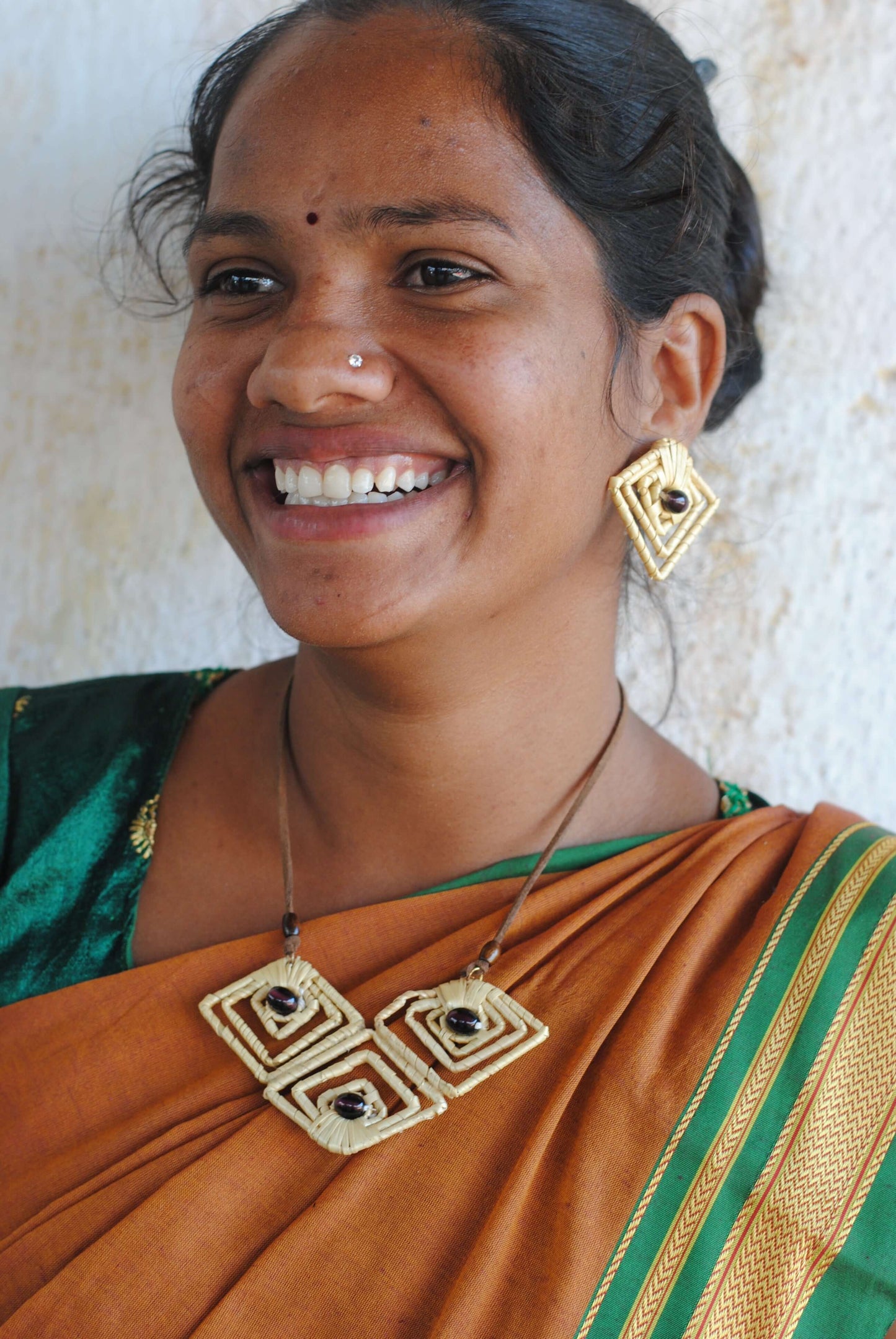 Truna natural fibre golden grass and copper enamel handcrafted jewelry from Odisha, diamond shape. Set of pendant and earrings