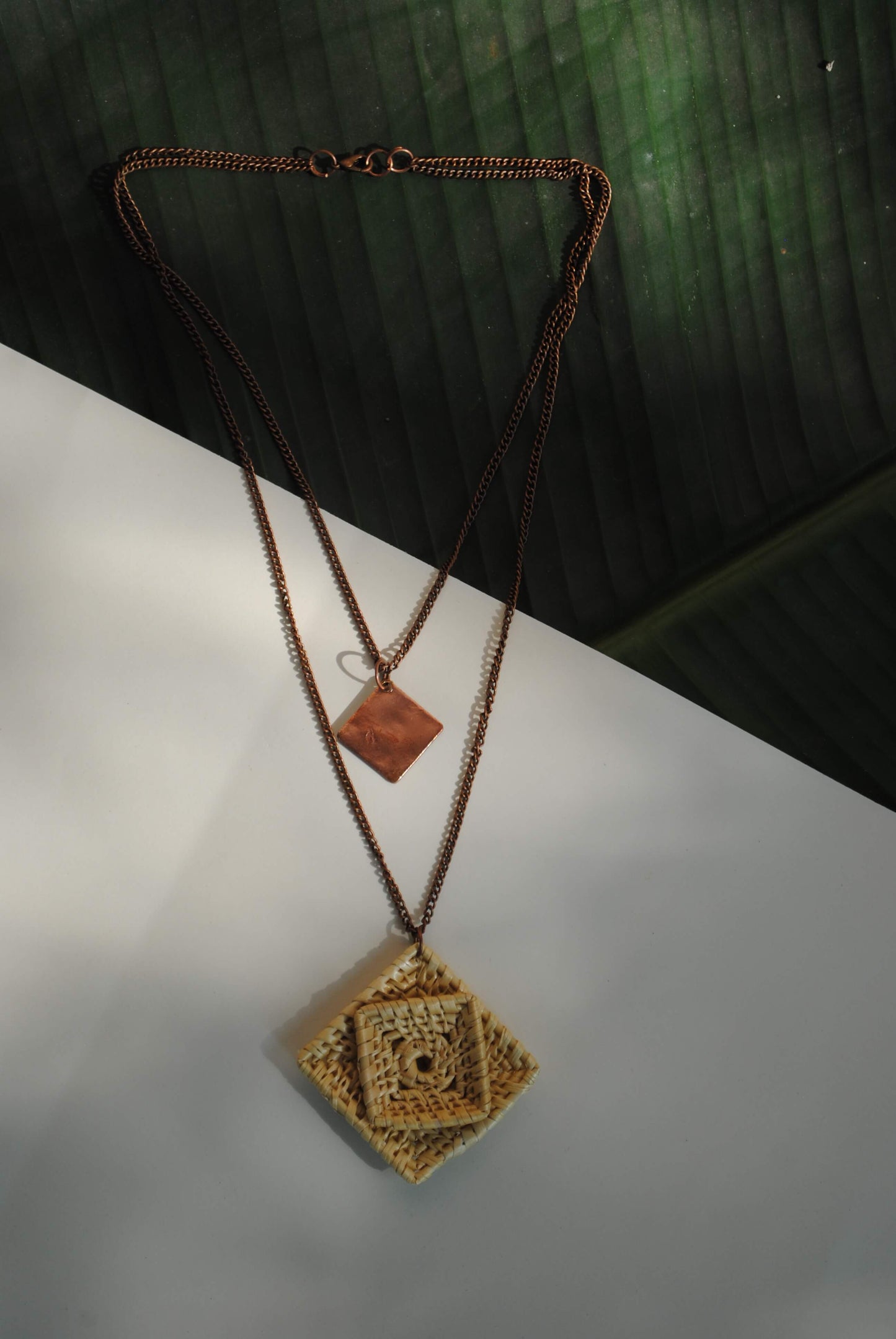 Truna natural fibre golden grass and beaten copper handcrafted jewelry from Odisha, Chaukon pendant