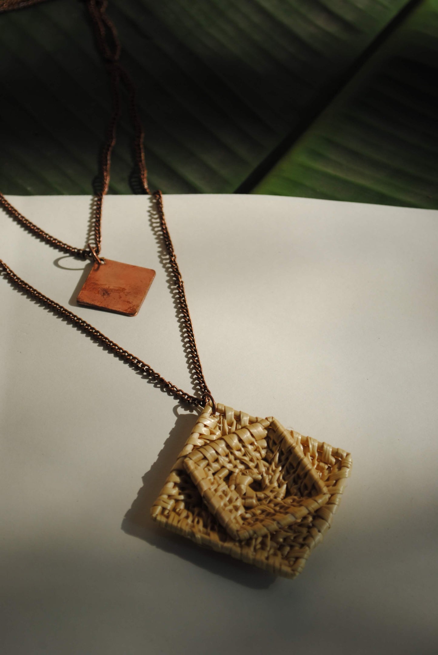 Truna natural fibre golden grass and beaten copper handcrafted jewelry from Odisha, Chaukon pendant