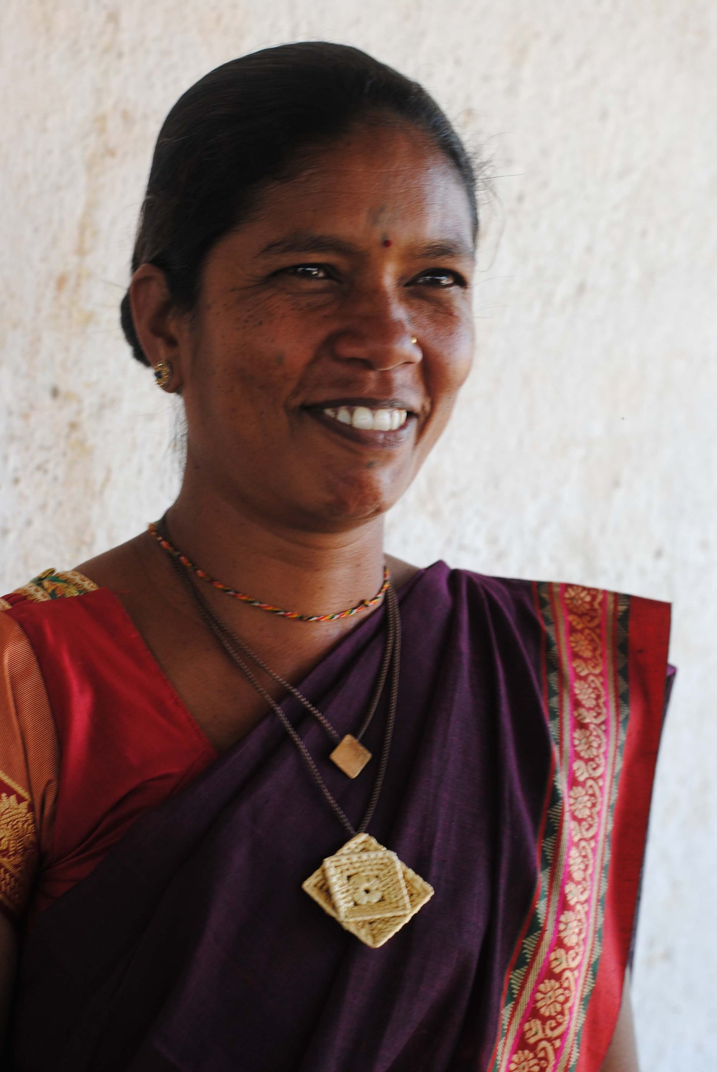 Truna natural fibre golden grass and beaten copper handcrafted jewelry from Odisha, Chaukon pendant