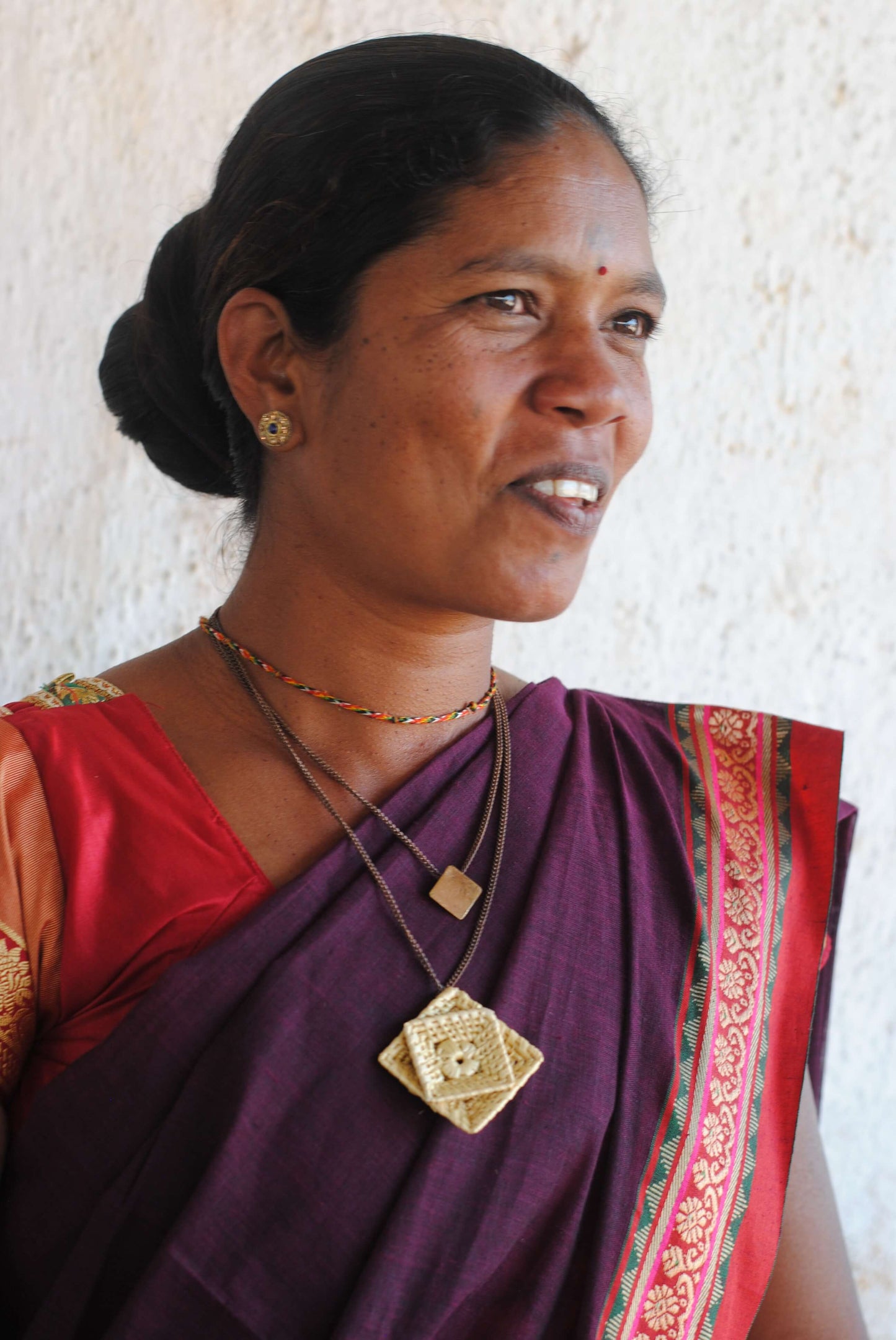 Truna natural fibre golden grass and beaten copper handcrafted jewelry from Odisha, Chaukon pendant