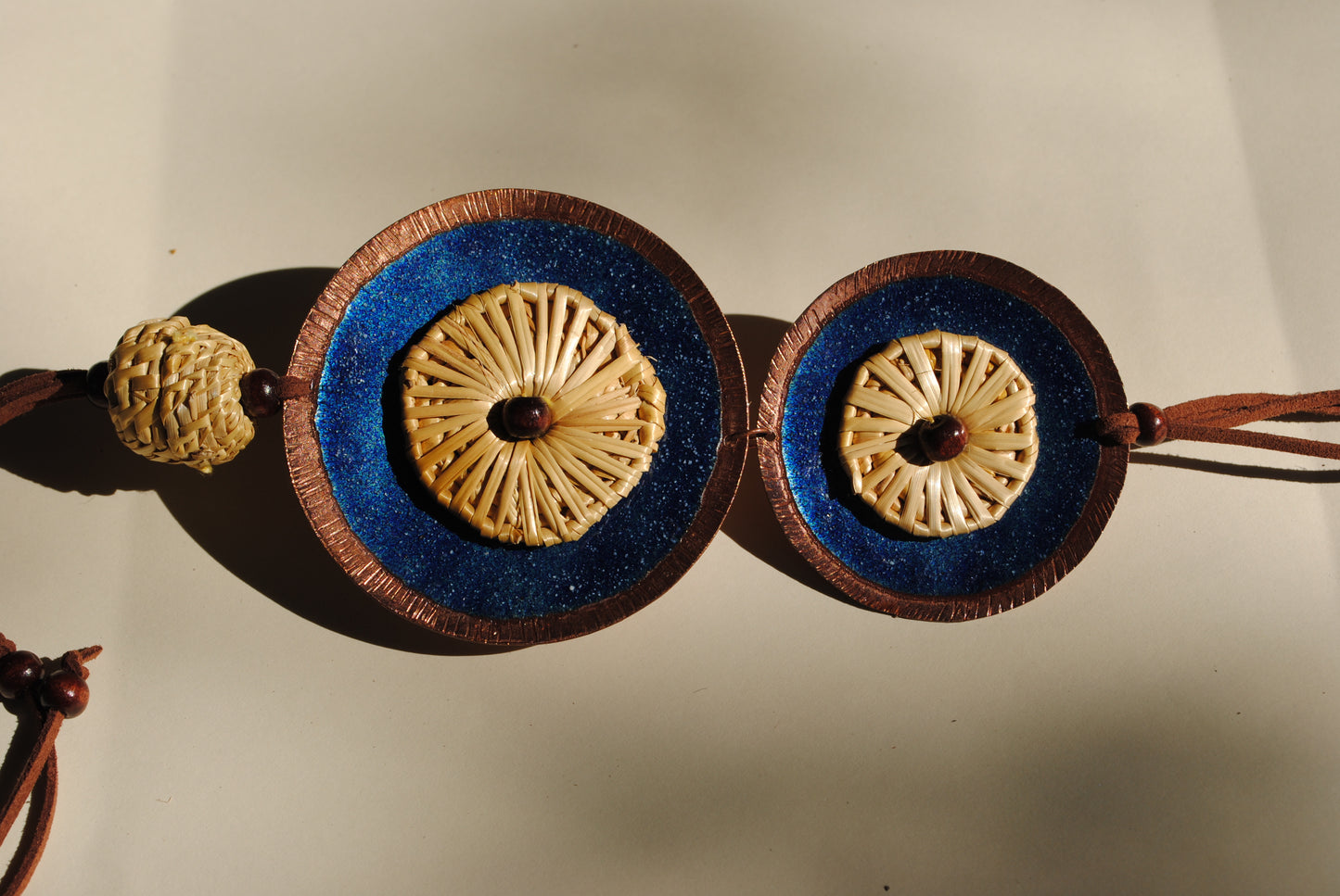 Truna natural fibre golden grass and copper enamel handcrafted jewelry from Odisha, Vaati blue enamel pendant
